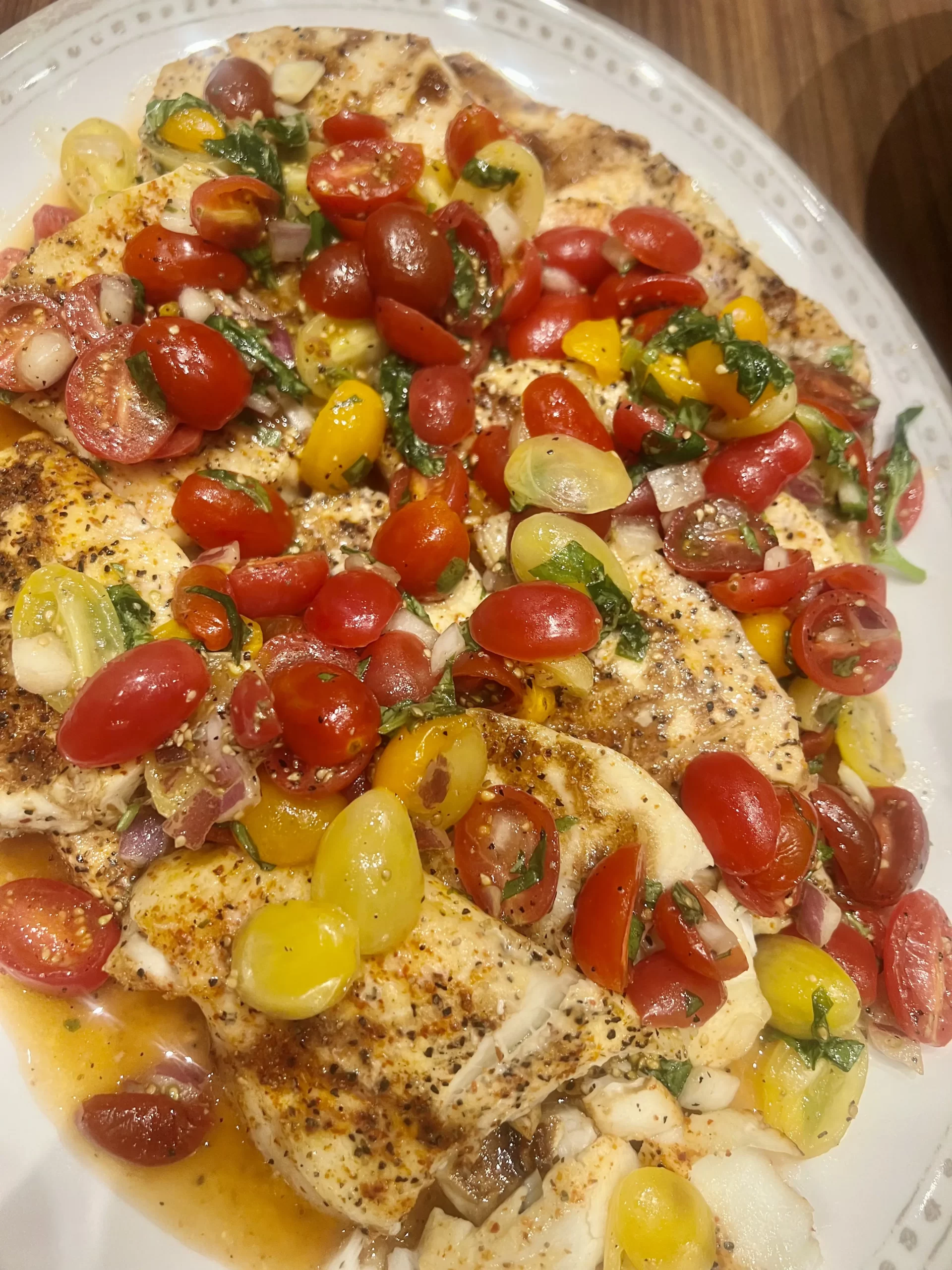 Baked Halibut with baby tomatoes and basil